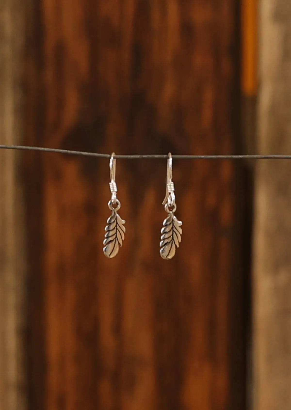 Tiny Silver Feather Earrings